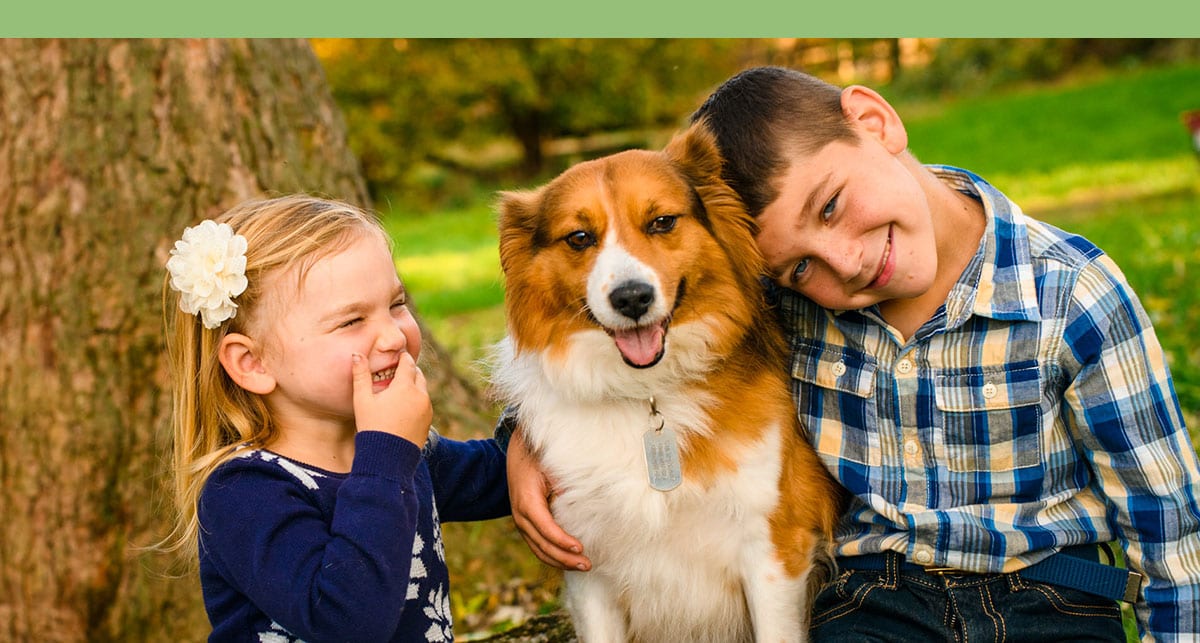 two-kids-with-dog